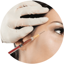 Woman receiving Botox injection for facial aesthetic treatment.